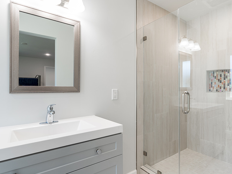 cabinet and mirror in a newly remodeled bathroom san diego ca