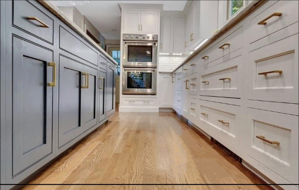 Drawers and cabinets are featured from this kitchen remodel. This along with a new oven and hardwood floors.