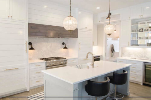 A white kitchen with pendant kitchen lighting.