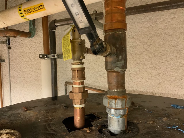 The top of the commercial water heater needing to be replaced.